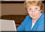Lady sitting by her computer